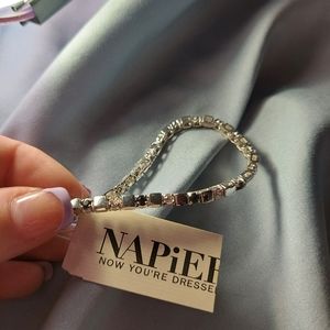 A black and silver bracelet that has never been worn